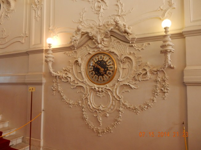 Clock on the wall in the Hermitage Museum