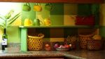 To the right of the sink, we placed baskets with oranges, lemons, etc and hung a few of the cups from the&nbsp;cabinets.